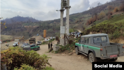 Iranian authorities take part in the confiscation of land owned by Baha'i villagers in the settlement of Ahmadabad in Mazandaran late last year. 