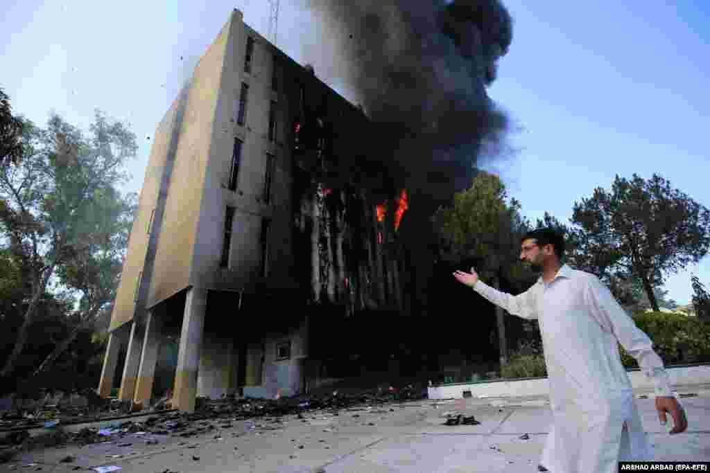 Flames rise from the Radio Pakistan building after violent protests broke out across the country following the arrest of Imran Khan, former PM and head of opposition party Pakistan Tehrik-e-Insaf, in Peshawar, Pakistan, on May 10.