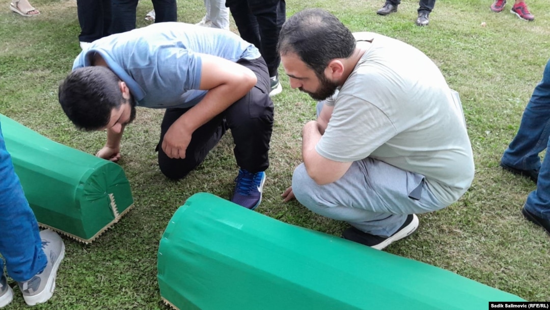 The remains of 14 recently identified victims of the 1995 Srebrenica massacre being prepared for burial