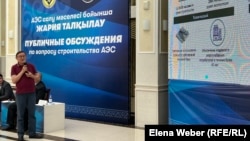 A speaker addresses the audience in July at a public hearing on the construction of a nuclear power plant in the Qaraghandy region.