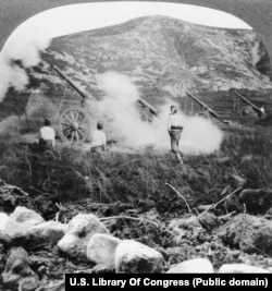 Japanese gunners fire towards Port Arthur during the siege.