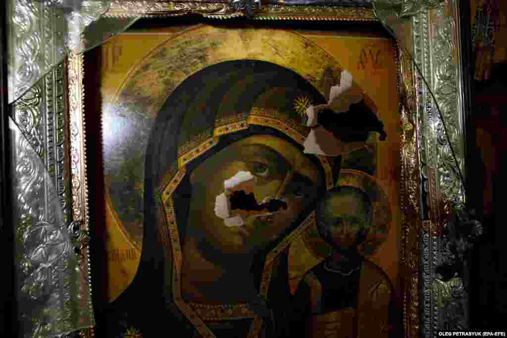 An icon damaged by shelling inside a church in Vuhledar. The deputy mayor of Vuhledar said earlier this year that the town was destroyed, with &quot;one hundred percent of the buildings damaged.&quot;