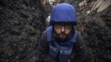 RFE/RL photojournalist Serhiy Nuzhnenko in a trench near the village of Pivdenne, near Toretsk in Donetsk region, April 2022. He and journalist Maryan Kushnir were forced to be in a trench because at that time the Russian military opened fire