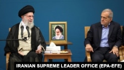 Iranian Supreme Leader Ayatollah Ali Khamenei (left) speaks at a government meeting on August 27 as President Masud Pezeshkian looks on.