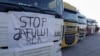 Romania - Transporters leave a parking lot in Bolintin Vale on their way to the Bucharest belt to protest