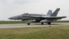 A F-16 jet taxis on a runway in Borcea, Calarasi, Romania, on May 15.
