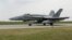 A F-16 jet taxis on a runway in Borcea, Calarasi, Romania, on May 15.
