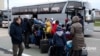 Children board a bus in Russian-occupied Ukraine bound for a camp in Belarus. (file photo)
