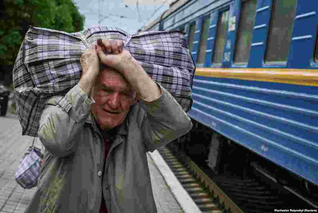A man boards a train to Lviv during an evacuation effort from war-affected areas of eastern Ukraine, in Pokrovsk, Donetsk region.