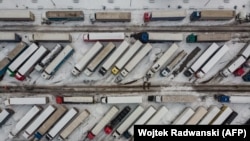 This aerial view shows Ukrainian trucks on the parking lot next to the Korczowa Polish-Ukrainian border crossing on December 5.