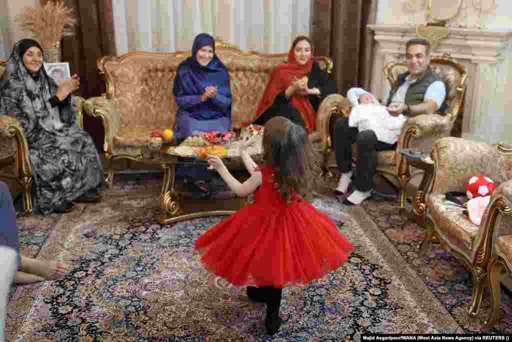 A young girl performs for her family during festivities in Tehran. The Persian New Year, which has been celebrated for at least 3,000 years, is one of the most important such holidays in the greater Persian world.