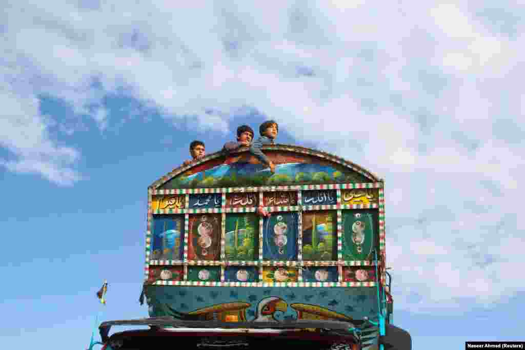 Afghan boys sit on a truck as they along with their family head back to Afghanistan from Pakistan, at the Chaman border crossing along the border with Afghanistan in Pakistan&#39;s Balochistan Province.&nbsp;