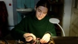 Ukraine - Violetta Oliynyk, an artist and jeweler builds drones for use on the front lines. screen grab