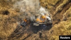A Russian tank burns in a field near the town of Vuhledar in Ukraine's eastern Donetsk region on November 5.