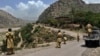 Pakistani soldiers patrol along a road in a northwestern district close to the Afghan border. (file photo) 