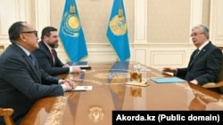 Kazakh President Qasym-Zhomart Toqaev meets co-founders of Kaspi.kz, Vyacheslav Kim and Mikheil Lomtadze, in Almaty in January 2024.