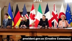 Canadian Prime Minister Justin Trudeau, Italian Prime Minister Giorgia Meloni, Ukrainian President Volodymyr Zelenskiy, and European Commission President Ursula von der Leyen join the virtual G7 leaders' meeting from Kyiv on February 24.