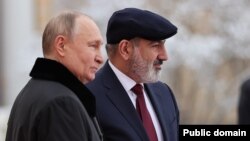 Russia - President Vladimir Putin greets Armenian Prime Minister Nikol Pashinian during a CIS summit in St. Petersburg, December 26, 2023.