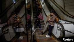 People take shelter inside a metro station during a Russian missile strike. (file photo)