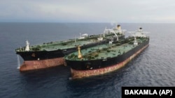 The Iranian tanker Arman (right), which was seized in Indonesian waters in 2023 while transferring oil to a foreign tanker. (file photo)