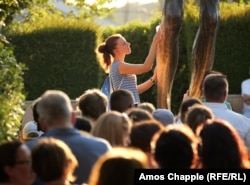 A young woman mops up the fluid that trickles from a statue of Jesus in the center of Medjugorje on August 3 as other pilgrims wait their turn. The liquid is said to have the same composition as human tears.