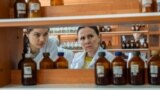 Moldova, Teachers enrolled in the re-qualification courses in chemistry do practical lessons in the laboratories of the State University