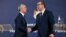 NATO Secretary-General Jens Stoltenberg shakes hands with Serbian President Aleksandar Vucic during a press conference following their meeting in Belgrade on November 21.
