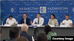 Sanzhar Boqaev (center) and other activists against the car-recycling system hold a press conference in Almaty on July 15.