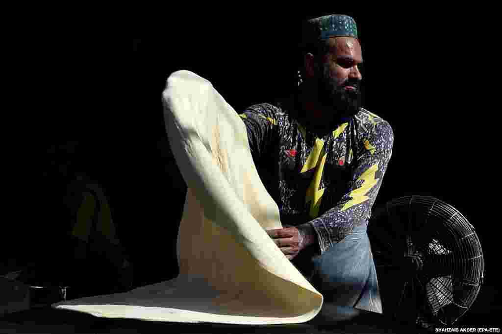 In Karachi, street vendors were busily preparing traditional food.