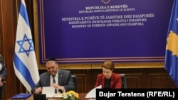 Israeli Interior Minister Moshe Arbel (left) and Kosovar Foreign Minister Donika Gervalla-Schwarz attend the signing ceremony in Pristina on June 18.