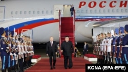 Russian President Vladimir Putin (left) walks with North Korean leader Kim Jong Un in Pyongyang during a state visit to North Korea in June. 