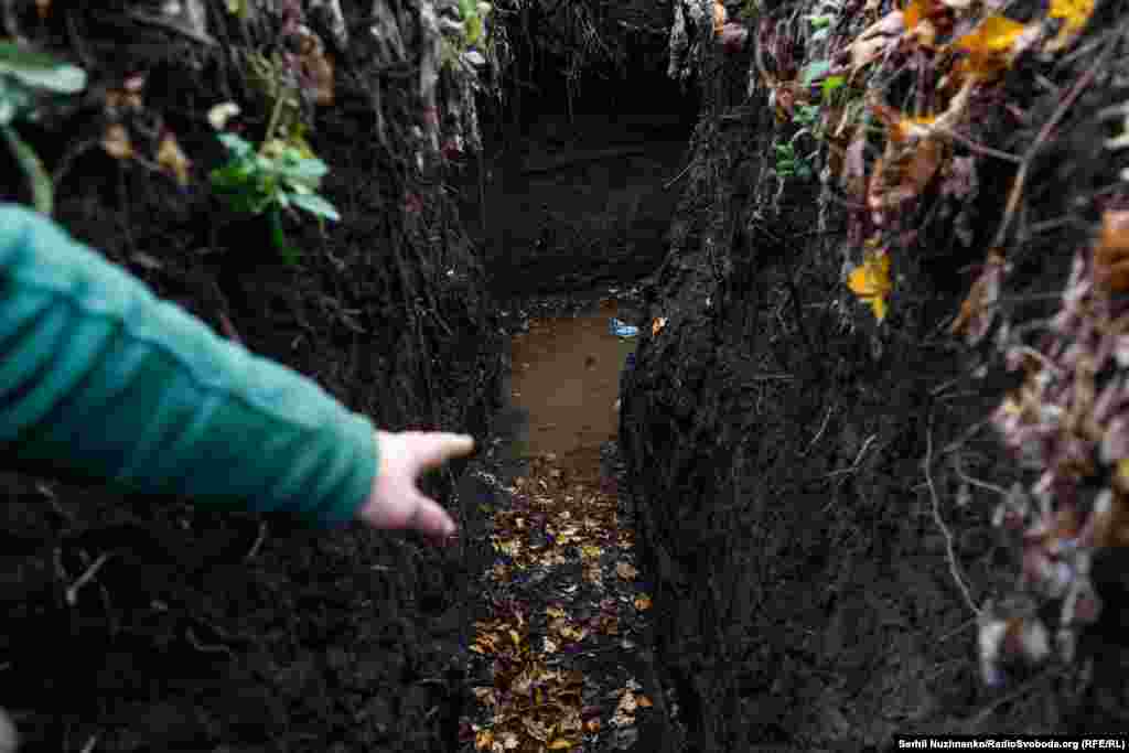 Lypa points out another battle these soldiers face, the constant flooding of their trenches that must be shoveled out. &quot;When the battle begins, you must stand in the cold water and fight,&quot; he said