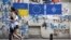 Graffiti on a wall in the old town of Tbilisi depicts the Ukrainian, EU, and NATO flags on May 23.