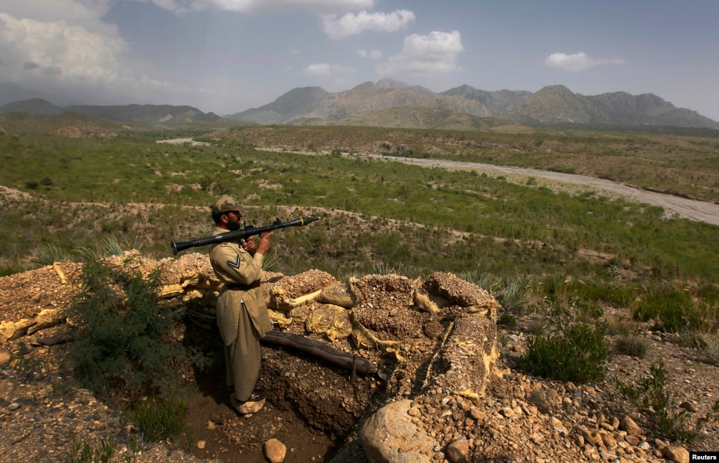 A Pakistani soldier holds a rocket launcher while standing in a bunker on a hill in Sadda, a town in Khyber Pakhtunkhwa close to the Afghan border.