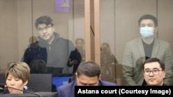 Quandyq Bishimbaev (top left) and Baqytzhan Baizhanov are seen in a courtroom in Astana on March 12.