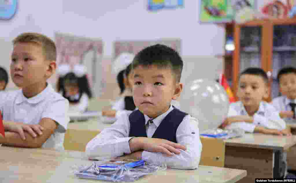 Kyrgyz first-graders sit attentively as class begins in Bishkek.&nbsp;An estimated 150,000 children entered the first grade this year in Kyrgyzstan.