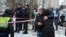 People react at the site of a Russian attack in Kyiv on January 23. 