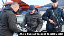 Kosovo's Interior Minister Xhelal Svecla inspects new weapons bought for Kosovo police.
