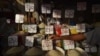 A vendor arranges a price sign at a market in Karachi, Pakistan, on June 26. 