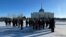 Kazakh security officers line up in Astana to block the path of protesters who wanted to head to the city's presidential office to protest the deaths of relatives killed during unrest in January 2022.