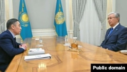 Kazakh President Qasym-Zhomart Toqaev (right) spoke to the state-run Egemen Qazaqstan newspaper.
