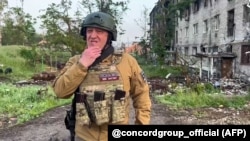 Prigojin, în orașul ucrainean Bahmut, într-o înregistrare video postată pe 25 mai. Putin a recunoscut rolul mercenarilor Wagner în lupta pentru cucerirea orașului, fără să-l menționeze însă pe Prigojin.