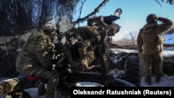 Ukrainian soldiers fire a L119 howitzer at Russian positions near the front line town of Maryinka in the eastern Donetsk region earlier this month.