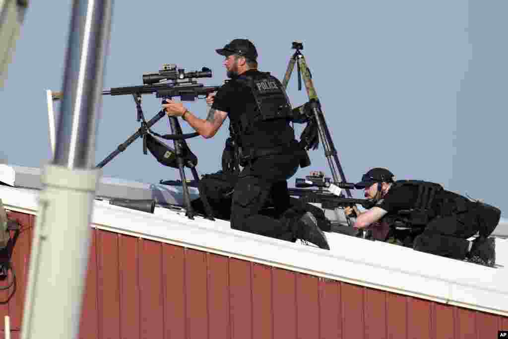 Police snipers return fire after shots were fired while Trump was speaking at the rally in Butler.