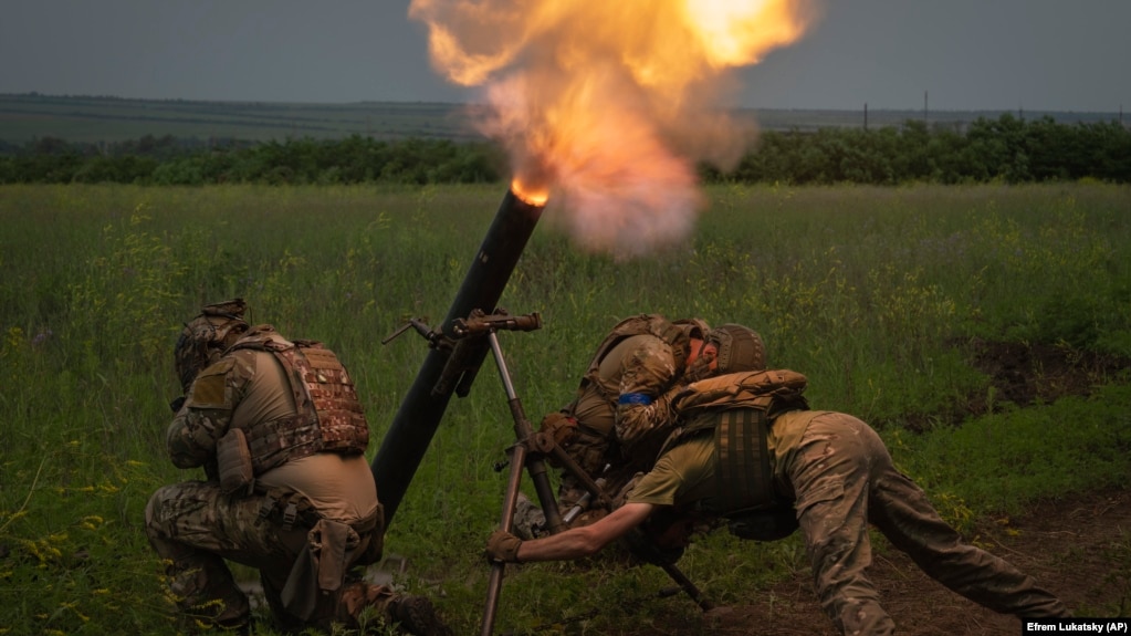 Ukrainian soldiers fire toward Russian position on the front line in Zaporizhzhya region of Ukraine on June 24.