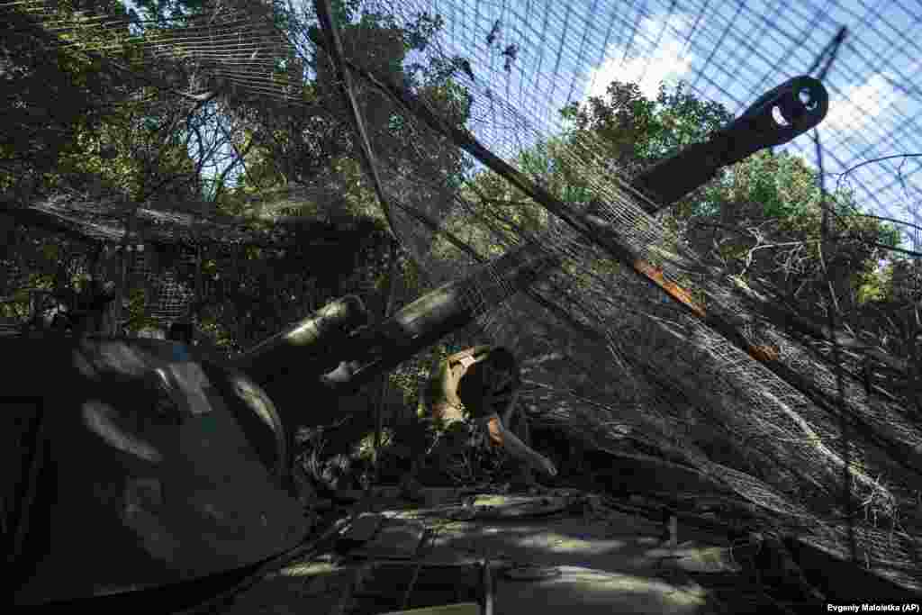 A Ukrainian soldier of the 30th Brigade prepares his self-propelled artillery to fire toward Russian position in the Donetsk region.