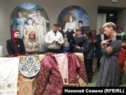 Visitors attend an exhibition on the 1944 deportation of the Crimean Tatars in Kyiv on May 17.