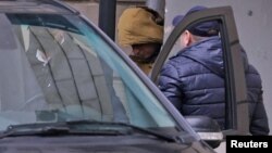 Evan Gershkovich leaves a court building in Moscow on March 30.