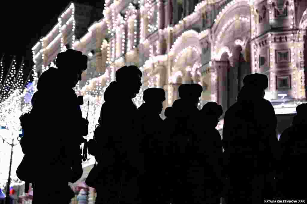  Law enforcement officers leave at the end of a rally and a concert celebrating the 10th anniversary of Russia&#39;s occupation of Crimea on Red Square in Moscow. &nbsp; 