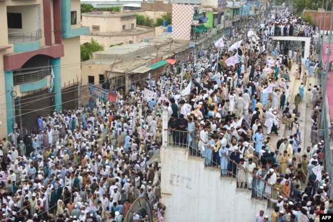 Residents take part in a July 19 peace rally to protest after the recent suicide attack by militants on an army enclave in Bannu.